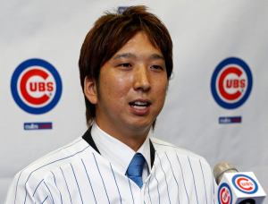 New Chicago Cubs relief pitcher Fujikawa of Japan speaks during a news conference in Chicago