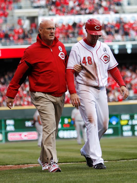 Reds left fielder Ryan Ludwick had to be taken off the field on Opening Day by trainer Paul Lessard due to a shoulder injury. He slid head first into Third Base and dislocated his right shoulder, tearing cartilage. The Reds will be without Ludwick for the next three months. Without his offensive production will the Reds stay atop of the National League Central. The OF hit for a 3 Slash Line .275/.346/.877 - with 26 HRs and 80 RBI in just 422 At-Bats in 2012. Ludwick signed a 2 YR deal with the Reds worth $15 MIL over the winter.