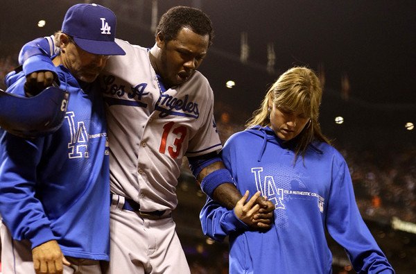 Hanley Ramirez is being helped off the field after suffering an injury on the basepaths during a game against the Giants. Ramirez was hitting .455 with a HR in his four games. He was put on the 15-Day DL with a strained left hamstring.
