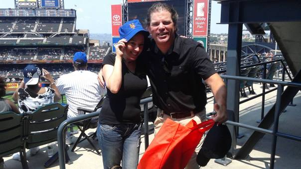 So Kat is featuring a Mets giveaway - which is a good idea when you are in the sun at Citi Field.  I am carrying 3 Curtis Granderson Fatheads in that red bag.  This is a rare photo without me having a hat on.